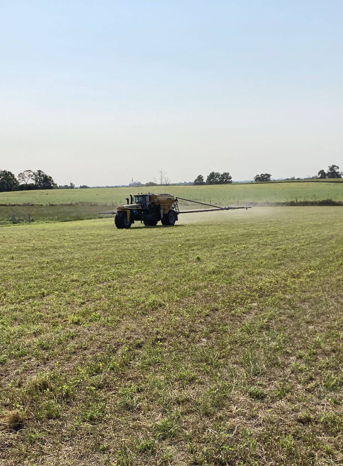 Photo of Alliance Agri-Turf's fertilizer equipment spaying fertilizer on crop Alliance Agri-Turf Fertilizer