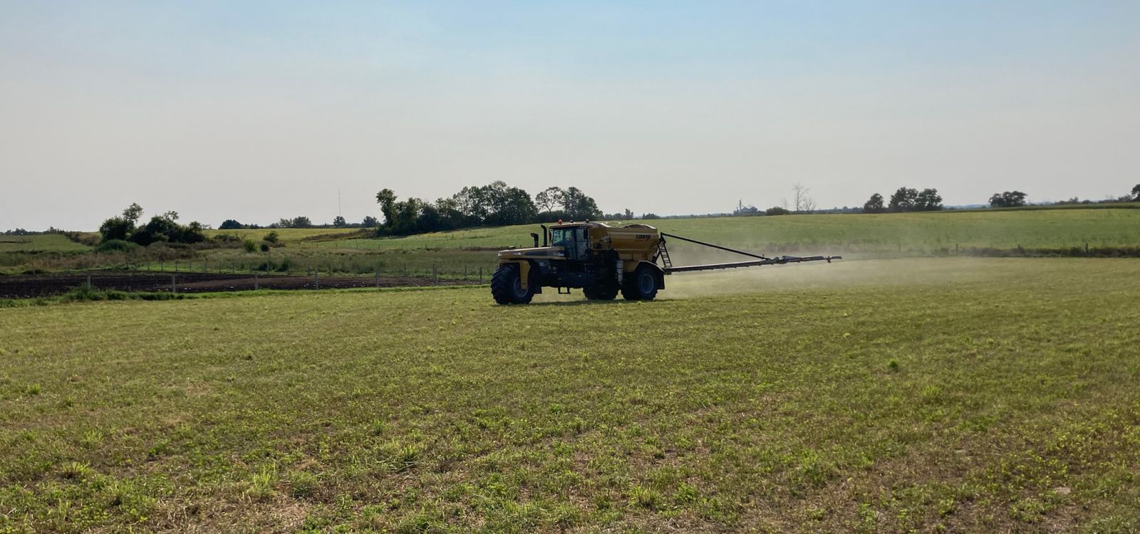 Alliance Agri-Turf fertilizer equipment working on crop
