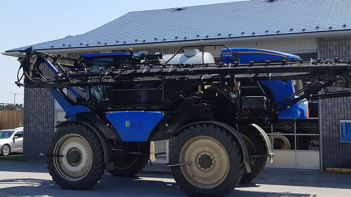 Alliance Agri-Turf blue custom sprayer at location
