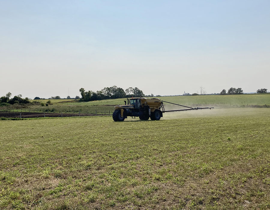 Photo of Alliance Agri-Turf's fertilizer equipment spaying fertilizer on crop Alliance Agri-Turf Fertilizer
